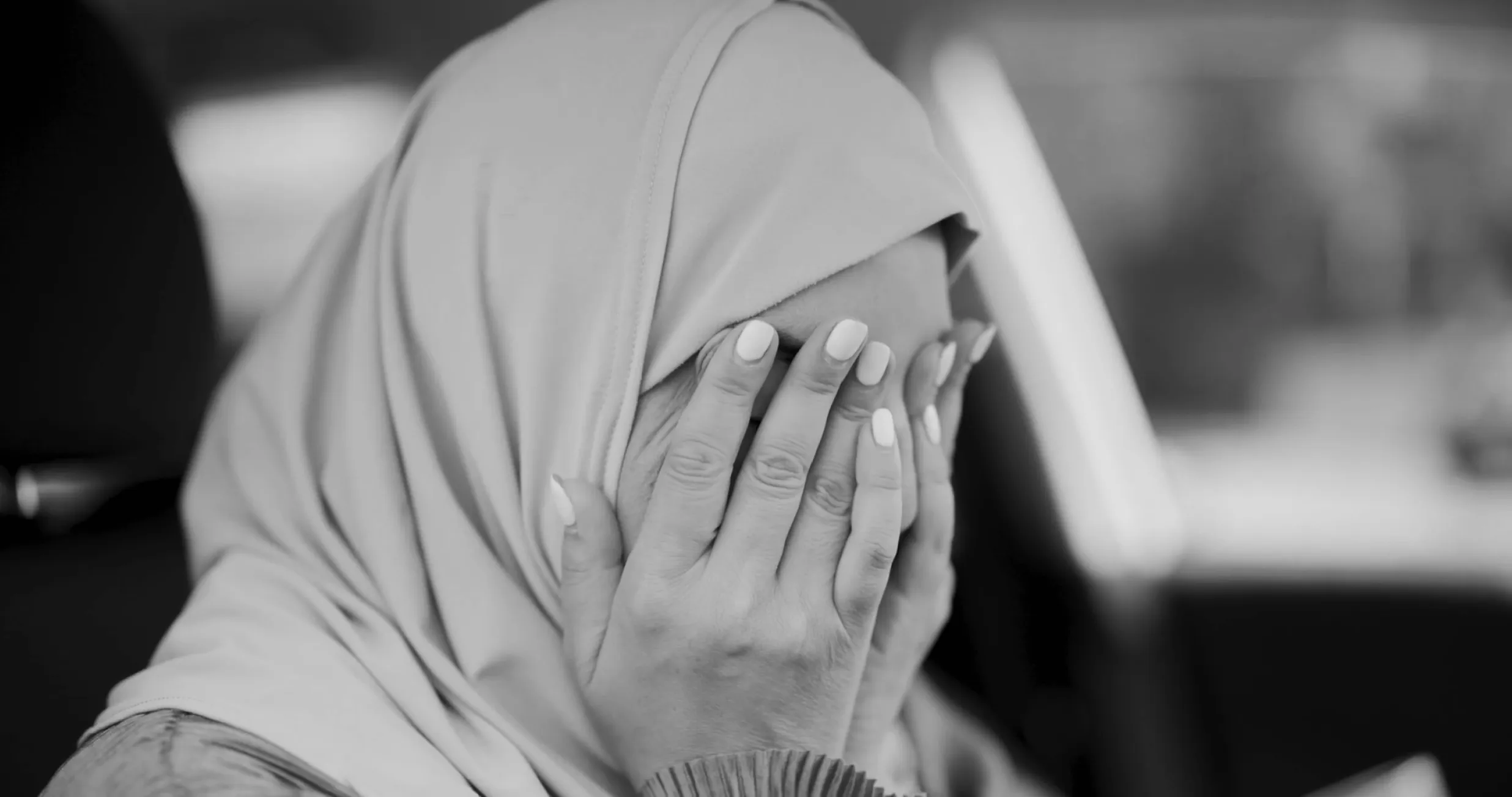 A woman in hijab in distress